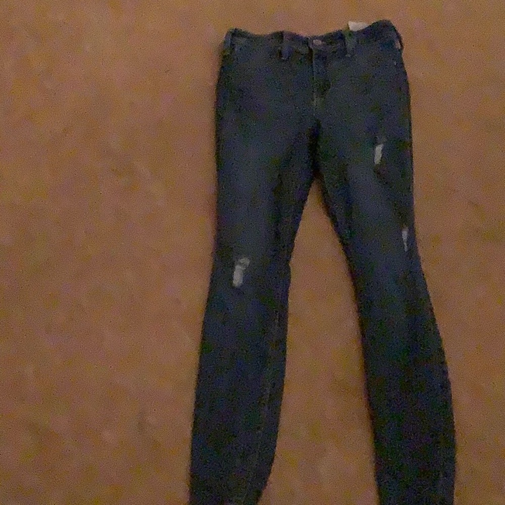 Blue ripped Hollister jeans.